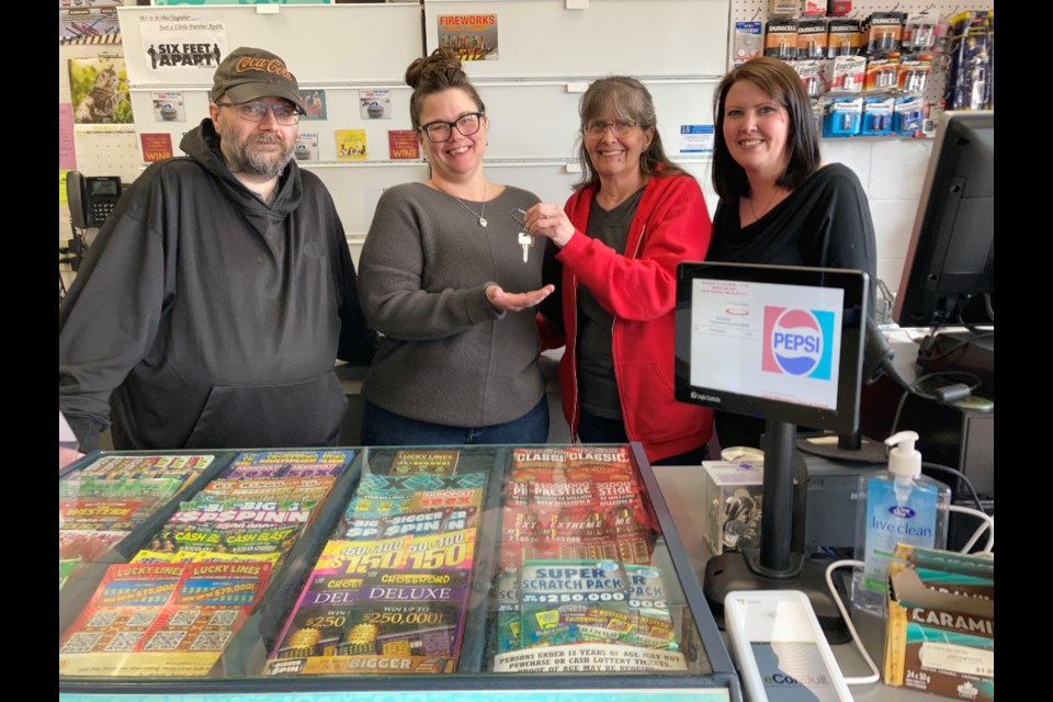 A mainstay Main Street business in Wilkie, Reddi-Mart, now has new owners. Brenda Stacey with her daughter Katrina Erickson hand over the keys to new owners Lauralee Kropf and her brother Jerel Wood. Missing from the picture is Kevin Kropf. 