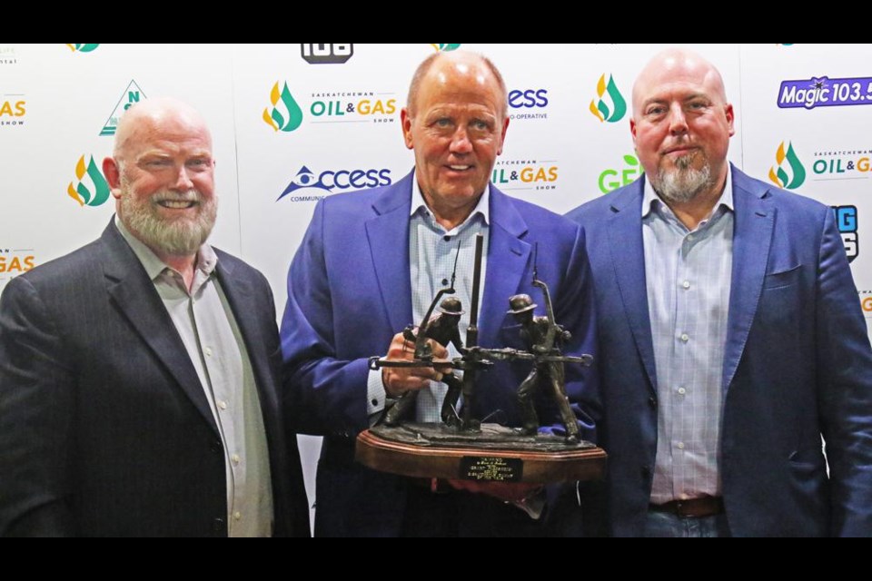 Grant Fagerheim, centre, of Whitecap Resources accepted the award as the Saskatchewan Oilman of the Year, and posed here with Del Mondor (left) of the Oil Show Board of Governors, and Oil Show chair Dan Cugnet at the Sask. Oil Show on Wednesday evening.
