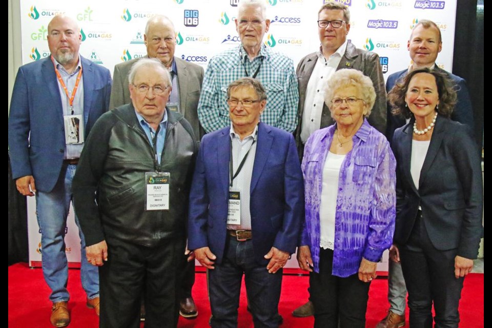 The Legends of the SE Sask oil industry gathered with Premier Scott Moe following the presentation of the awards at the Sask. Oil and Gas Show; in the back are Oil Show chair Dan Cugnet, Legends Ron Carson and Ken Lee, Premier Scott Moe and Weyburn-Big Muddy MLA Dustin Duncan. In front are Legends Ray Frehlick, Norm Mondor and Vi Day, with Justice Minister Bronwyn Eyre.