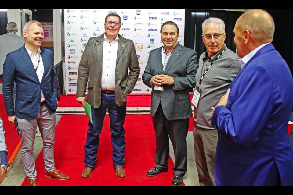 Weyburn-Big Muddy MLA Dustin Duncan, Premier Scott Moe, MLA Ken Cheveldayoff chatted with Darcy Cretin and Grant Fagerheim of Whitecap Resources just prior to lunch on Wednesday