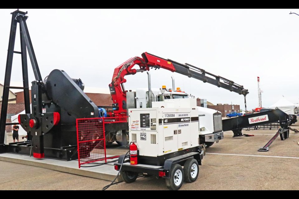 A crew prepared to set up a pumpjack on the Weyburn fair grounds on Friday, in preparation for the Sask. Oil and Gas Show, set to open on June 1st