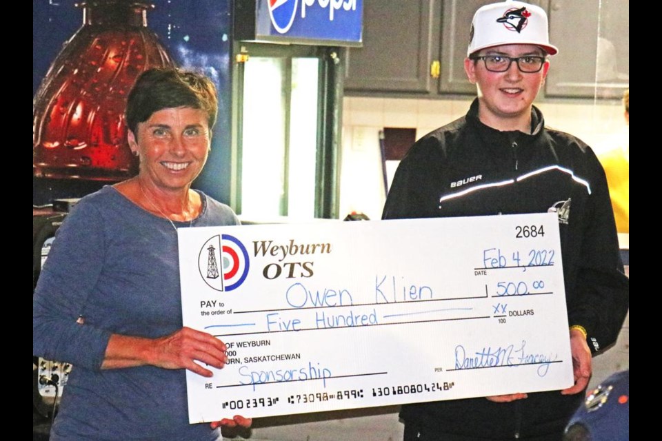 Danette Tracey from the Weyburn OTS presented Owen Klein with the Michael Mainil-Kim Brady True Grit Award, given to a junior curler in Weyburn each year