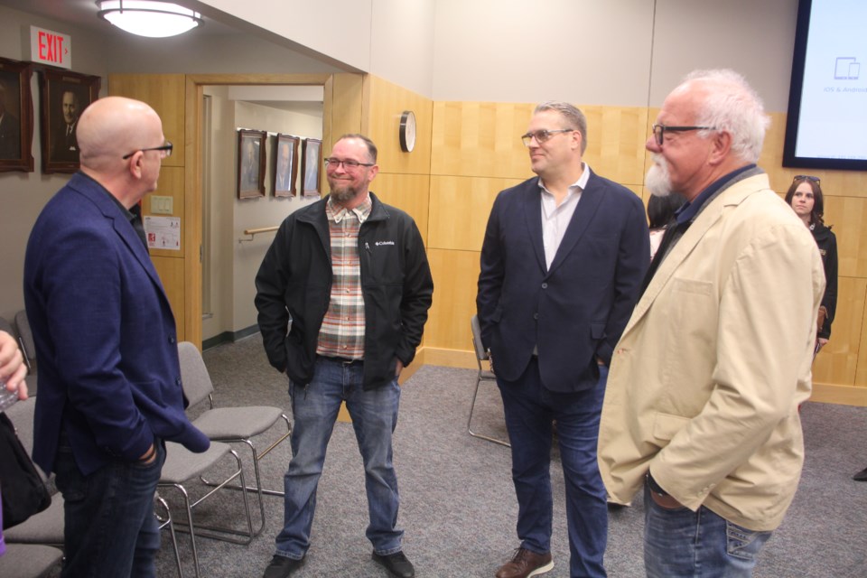 Mayor Jeff Richards speaks with Dan Seminuk (Weyburn Facility Manager),  Trevor Thomas (Founder) and Hank Froese (vice president of farmer relations and processing) from the PCE Leadership Team. 