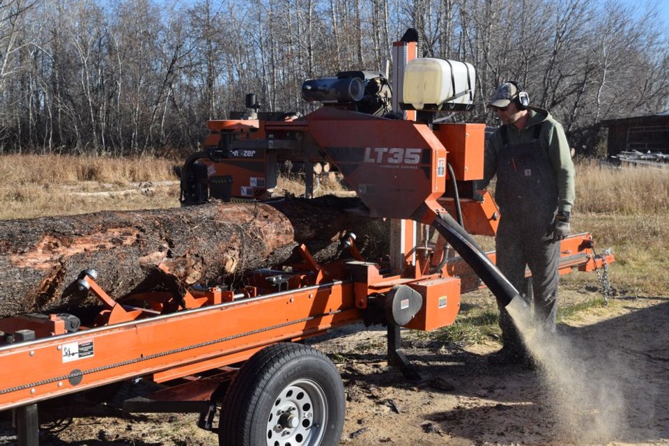 After the onset of the pandemic in early 2020, Damon Paley of Canora decided it was time he and his family became more self sufficient. He bought a sawmill, which has since attracted numerous customers. Paley attempts to utilize as much of the wood as possible, including the sawdust which is prized by some gardeners for suppressing leaves around trees. / Rocky Neufeld