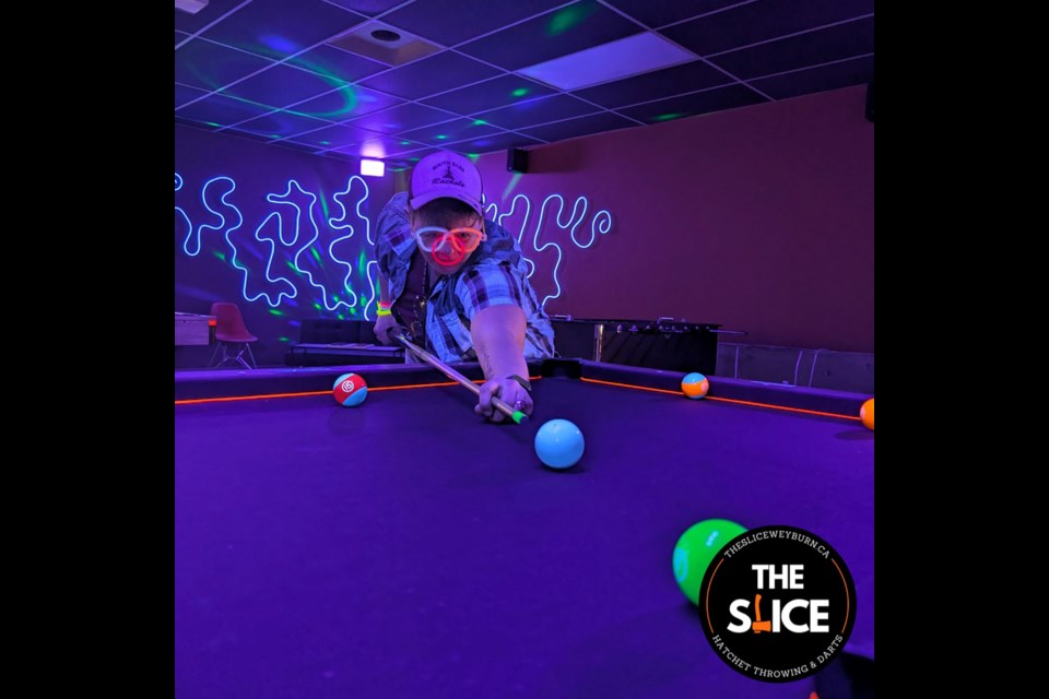 The Slice has become a local destination for axe throwing and interactive play.
