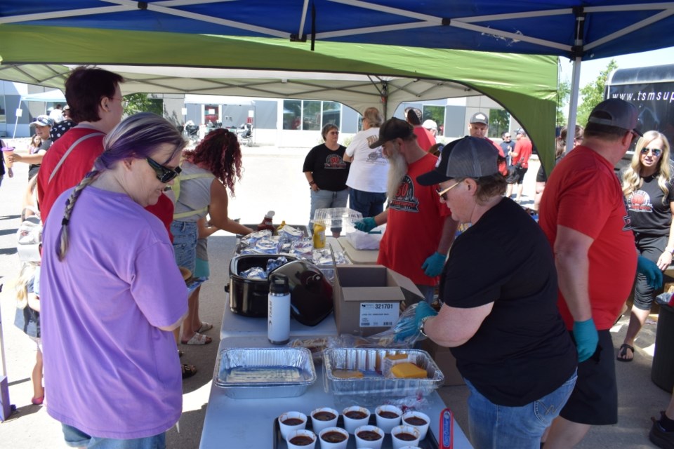 TS&M Supply employees served up hotdogs and hamburgers.