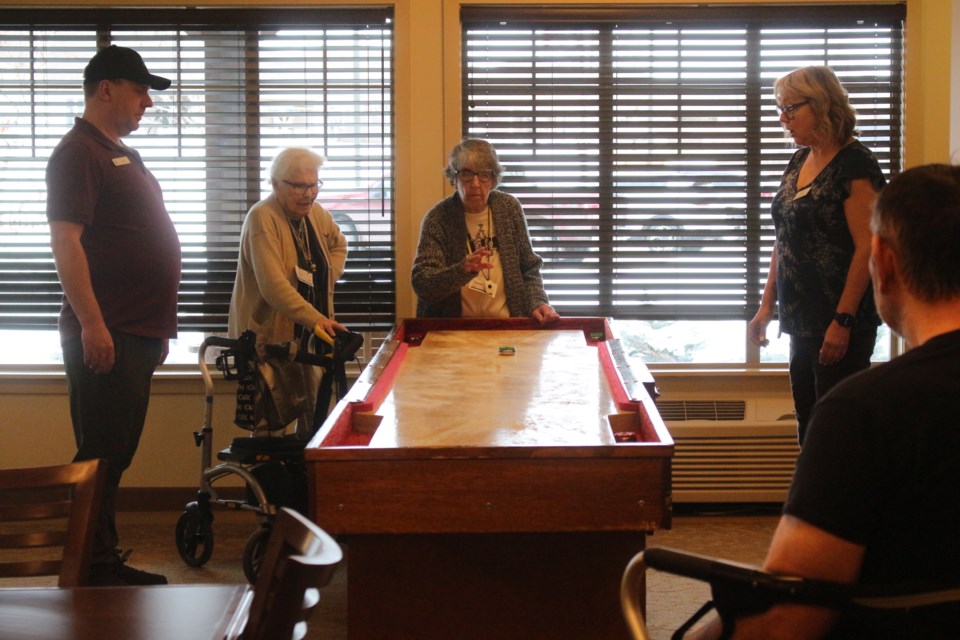 Shuffleboard was one of five activities for participants to compete in.