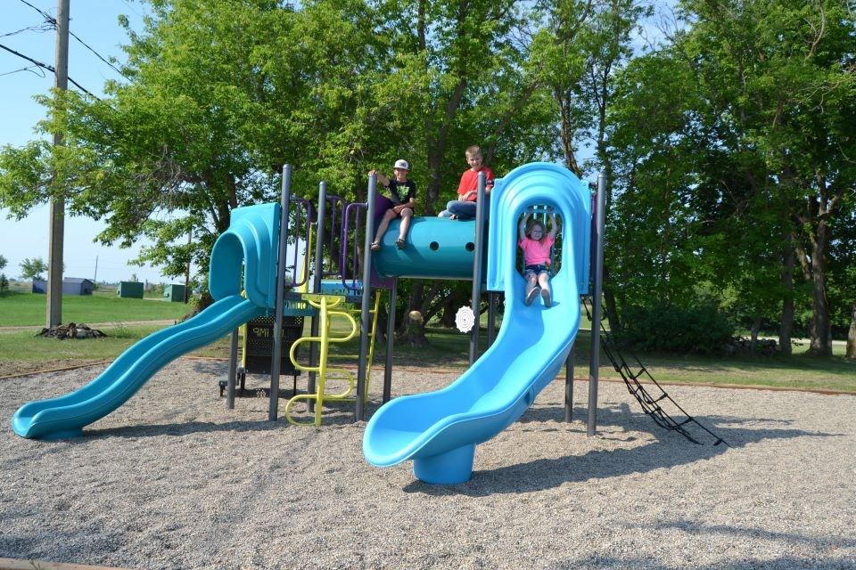 Children enjoyed playing on the newly installed playground equipment in Stenen, from left, were: Oliver Anaka, Dawson Serdachny and Everleigh Anaka