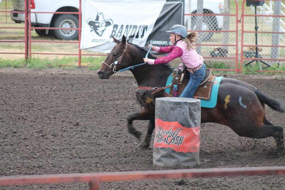 Madison Leonard rounds the last barrel before dashing to the finish line. 