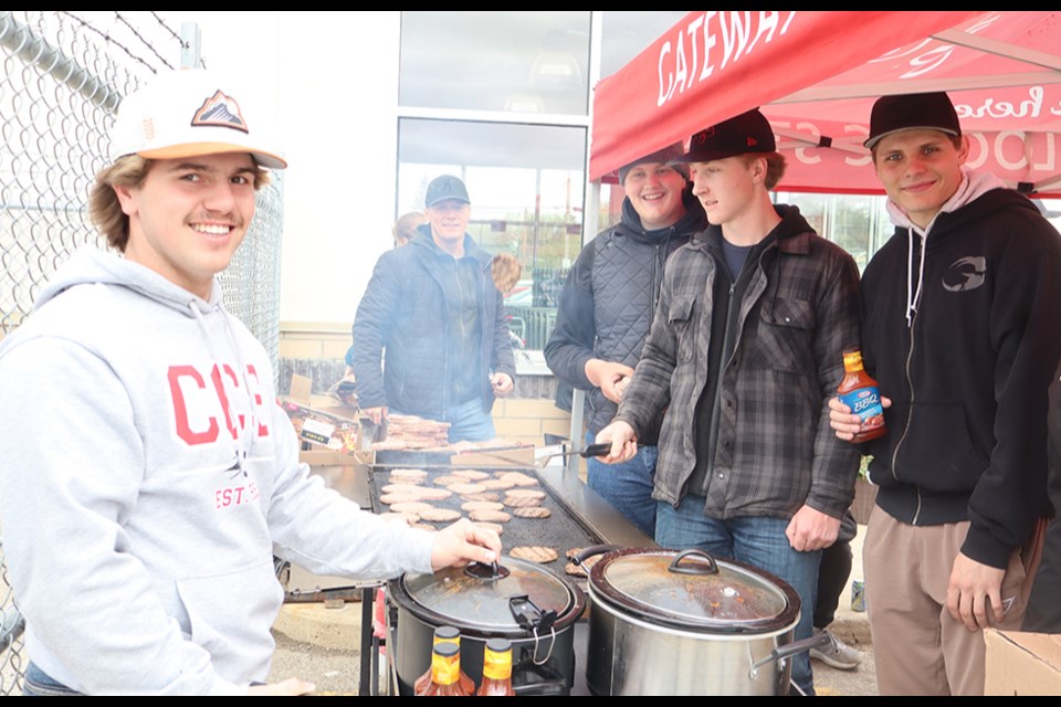 Tasked with the important job of flipping burgers at the CCS Grad Fundraiser Barbecue on May 16,, from left, were Grade 12 students Ty Sleeva, Noah Prychak, Briel Beblow and Matthew Makowsky. 
