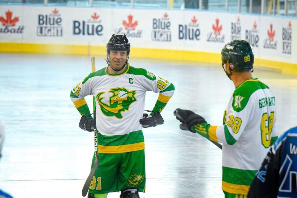 Saskatchewan Mammoth captain Brock Harrison takes a moment to talk to teammate Justin Bernhardt.