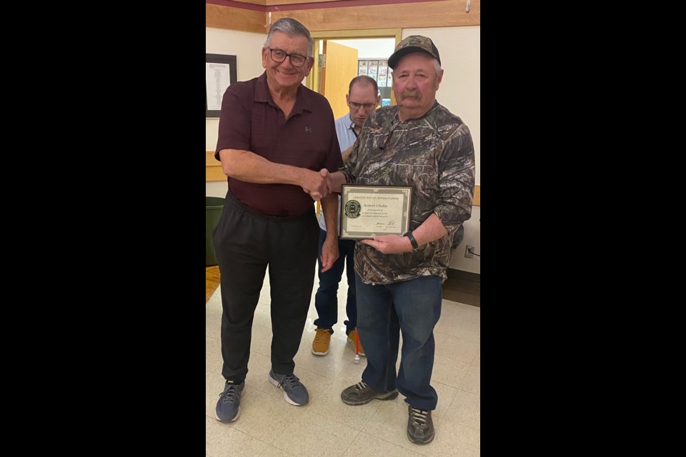 Lyle Bucah, representing Saskatchewan Association for Firearm Eductaion, recognized Rob Cholin, president of the Kerrobert Wildlife Federation, for his 40 years of teaching hunters safety education. 