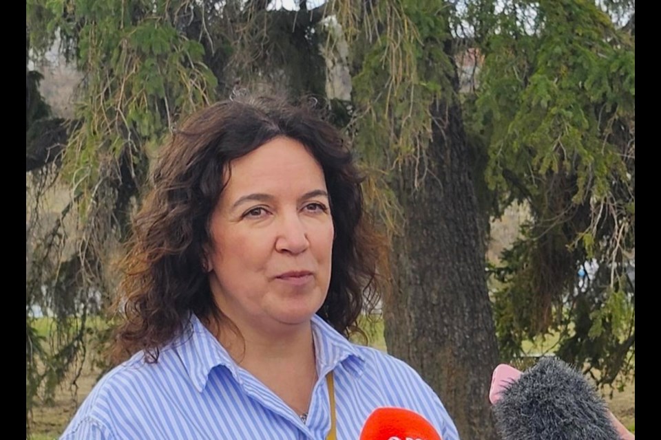 Broadway Business Improvement District Executive Director Anne-Marie Cey answers questions from the local media in a press conference on Wednesday, April 30, at Friendship Park.