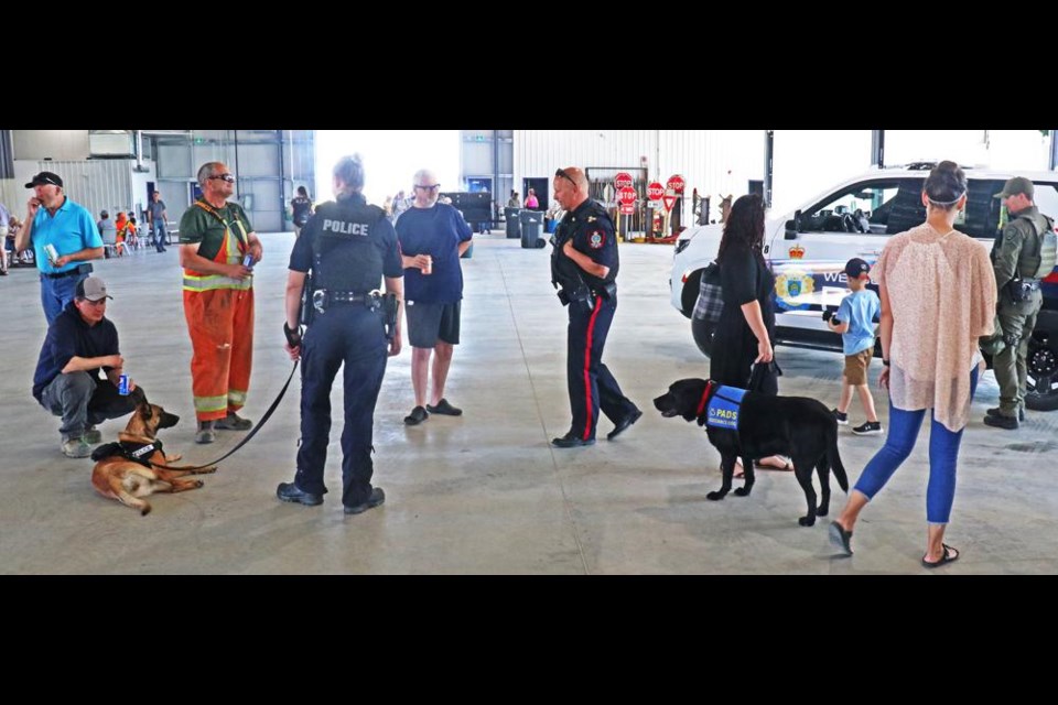 The Weyburn Police dog, Oakley, and the Victim Services dog, Beaumont, were both with their handlers meeting people at the City of Weyburn's open house.