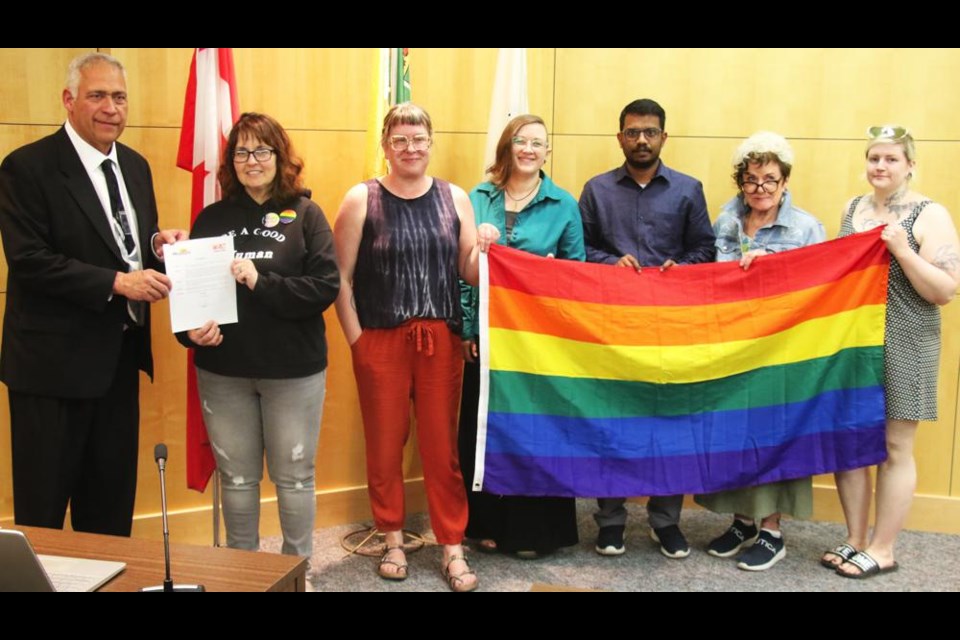 Weyburn Mayor Marcel Roy proclaimed June 4-10 as Pride Week in Weyburn, with members of the Weyburn Arts Council, chair Tasha Hill, city rep Regan Lanning, Krista Klemmer, Chris Christie, Linda Aitken and Kristyn Storey.