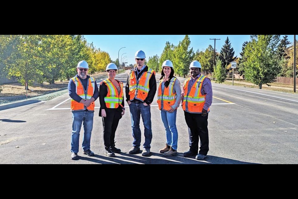 The City of Weyburn’s Engineering and Public Works staff involved in the project at the intersection of 16th Street and First Avenue gathered on Tuesday as it was completed. From left are Kevin Linnen, public works superintendent; Jennifer Wilkinson, city engineer; Andrew Williams, transportation manager; Renee Cugnet, municipal engineer; and Ramji Yellamelli, municipal engineer technician. The intersection was opened to traffic once again as of Tuesday evening.