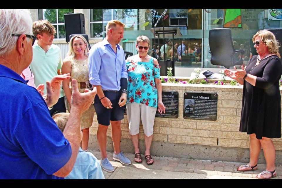 WIth his family gathered around, Curt Minard saw the plaque unveiled on the Walk of Fame on Saturday afternoon.