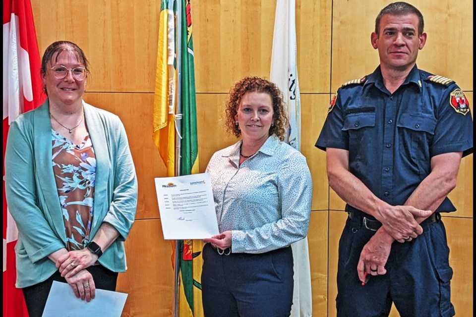 From left are deputy mayor Laura Morrissette, Abby Kradovill, the City of Weyburn’s Safety Co-ordinator, and Weyburn Fire Chief Trent Lee, with the proclamation for Emergency Preparedness Week, May 7-13.