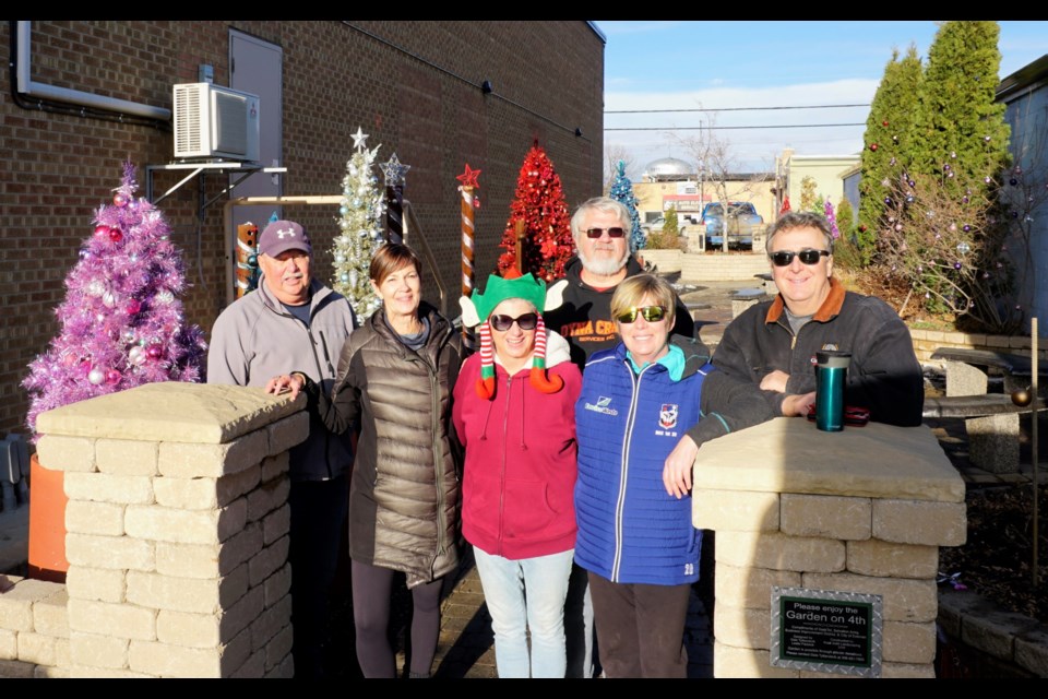 From left, Lindsay and Wendy Clark, Gale and Kelly Tytlandsvik, and Brenda and Brent Blackburn were out decorating the Garden on Fourth for Christmas last Friday                               