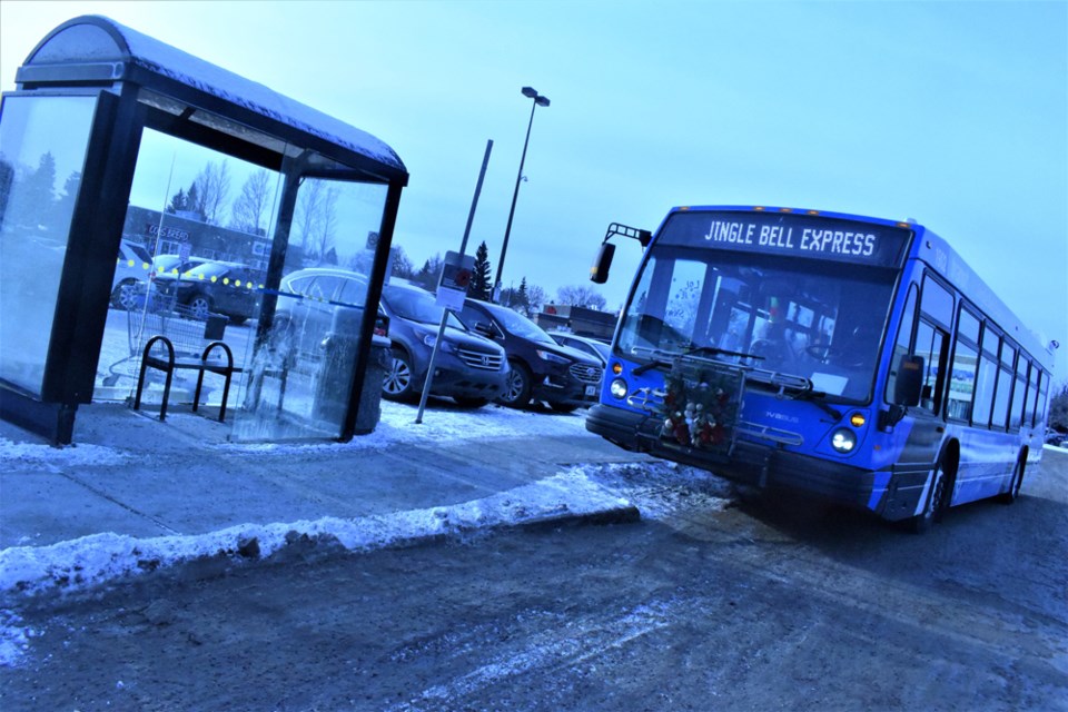 The Jingle Bell Express waits for passengers to ride the special shopping route outside Lawson Heights Mall on Monday.
