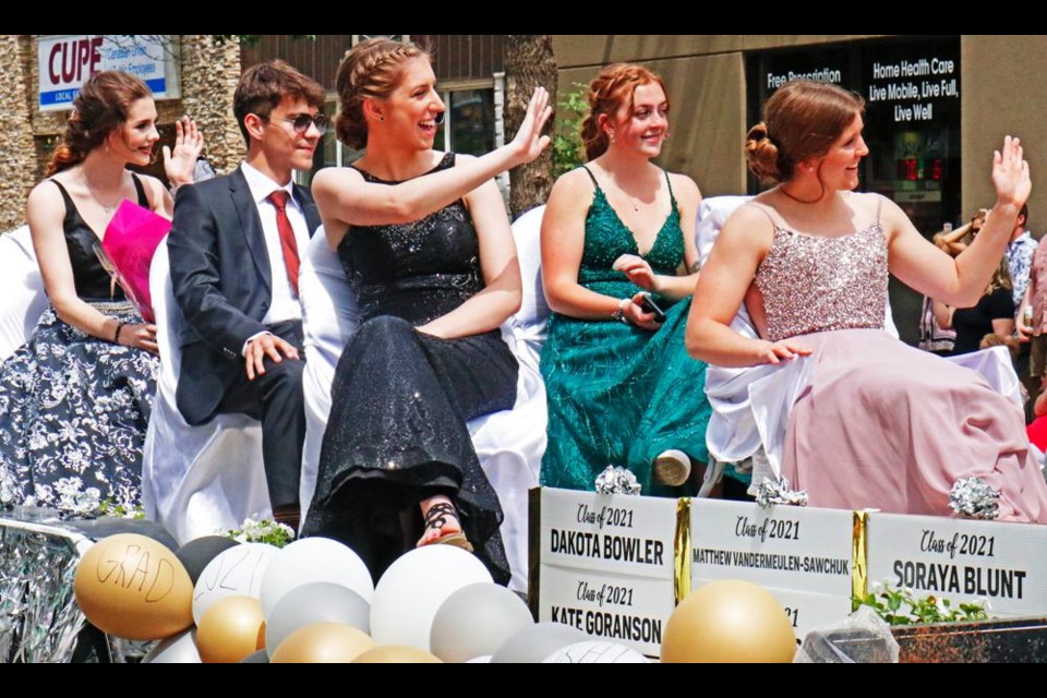 One of many floats with graduates from the Class of 2021 waved to friends and family watching along Third Street, during the grad parade on June 19. This float included Soraya Blunt, Matthew Vandermeulen-Sawchuk, Kate Goranson and Dakota Bowler.