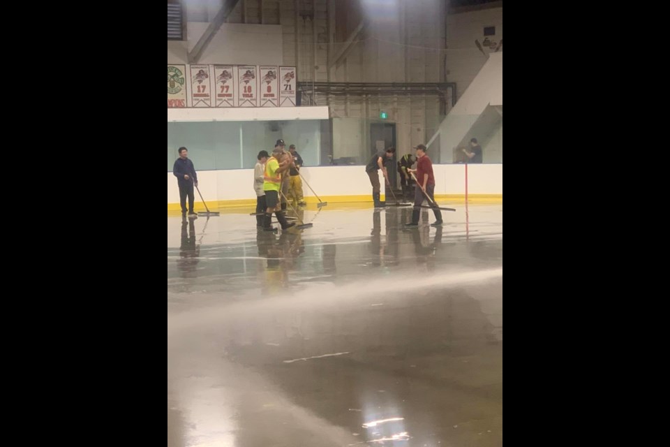 Kerrobert Fire Department was joined by other community volunteers to help prepare the arena surface for ice installation.