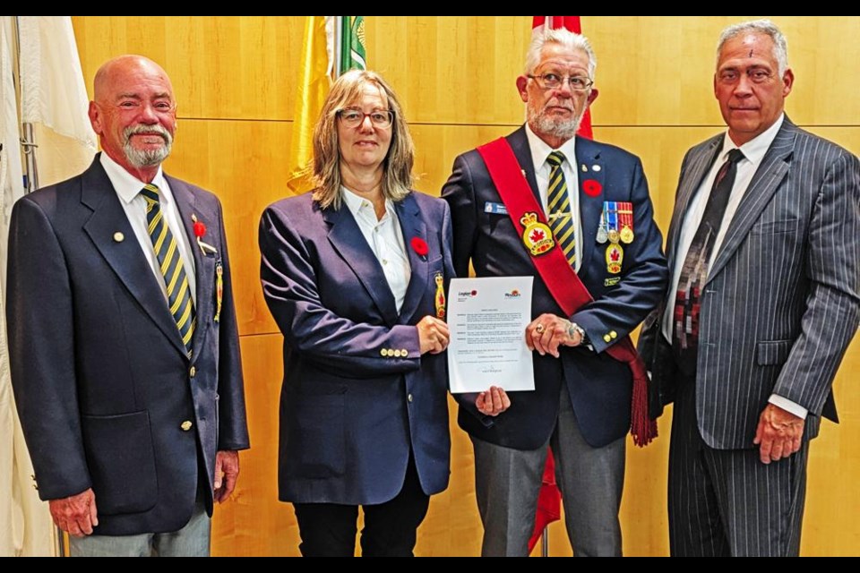 Jerry Ponto, Conni Fowler and Owen White of the Weyburn Legion were presented with a copy of the proclamation for National Legion Week by Mayor Marcel Roy on Monday night.