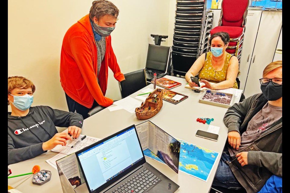 Dungeons and Dragons players gathered to take part in the role-playing table-top game at the Weyburn Public Library recently. From left are Marcus Isaak, Jaxon Kradovill, Sabrina Kraft and George Hoffman. There has been great interest in the game, and a second game may soon be set up at the library.