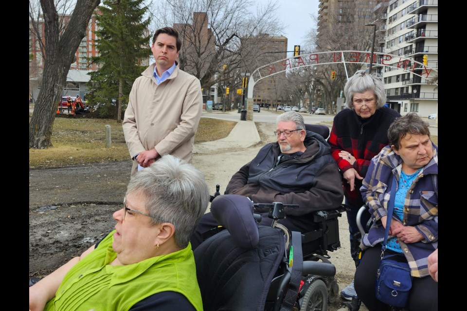 Lynnett Boris recounts what she experienced at King Edward Place in front of local reporters.