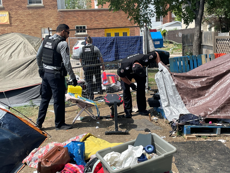 police-check-homelessness-encampment