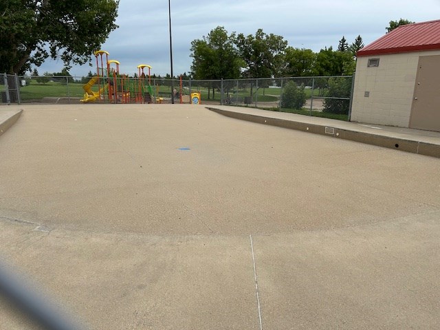 An empty paddling pool in Silverwood Heights until a waer line leak can be repaired.