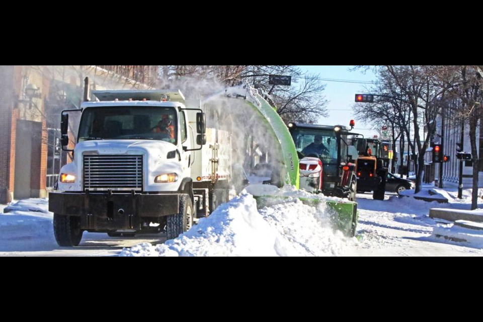 CIty crews were kept busy Tuesday clearing up the heavy snow that clogged Weyburn's streets.