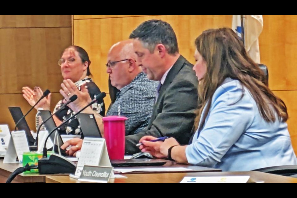 Tina Clay, far right, was welcomed as the City of Weyburn's new city clerk, as councillors Laura Morrissette and Larry Heggs applauded after making her appointment official on Monday evening. City manager Mathew Warren is in the centre.