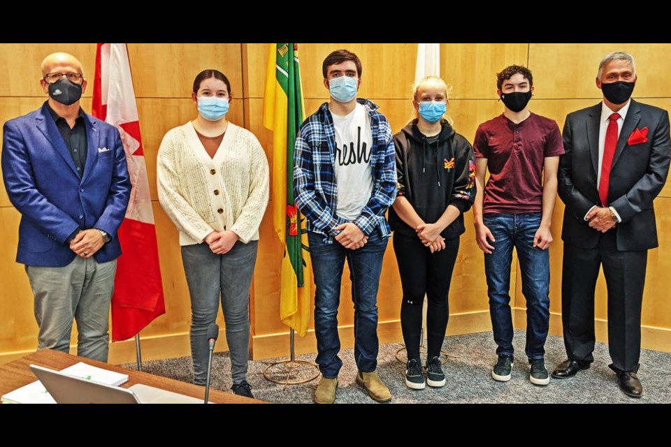 Members of Weyburn's youth council were introduced at the city council on Monday. From left are Coun. Jeff Richards, secretary Gracyn Knipfel, youth mayor Dalton Molnar, councillors Nikola Erasmus and Josh Wiens, and Mayor Marcel Roy; missing was youth councillor Erika Sinn.