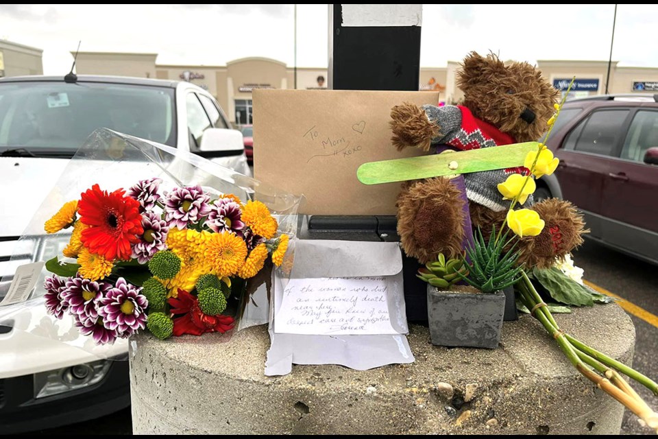 A tribute for Carol Pearce has been put up in front of the Saskatoon drug store where Carol Pearce died after allegedly receiving a Covid booster shot. 