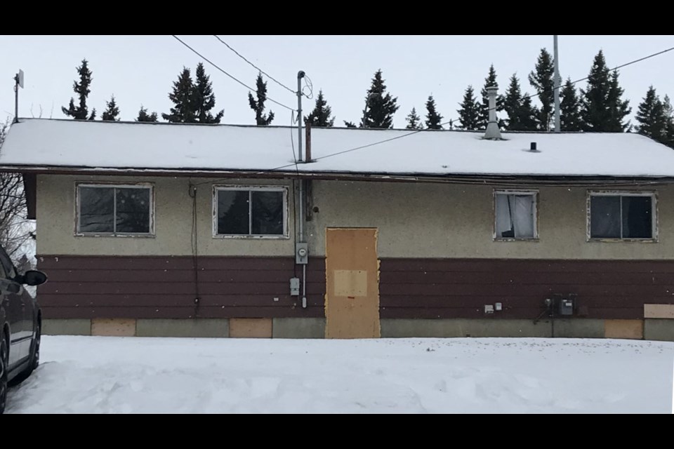 The doors to what was once Luke Dean's home at 4602 - 44 Street, Lloydminster, Sask., are boarded up in this now condemned house. RCMP found a torture chamber in the basement. 