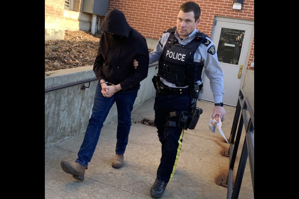 Michael MacKay is taken from the courthouse Nov. 20 in handcuffs. He had been out on bail since April 2021. 