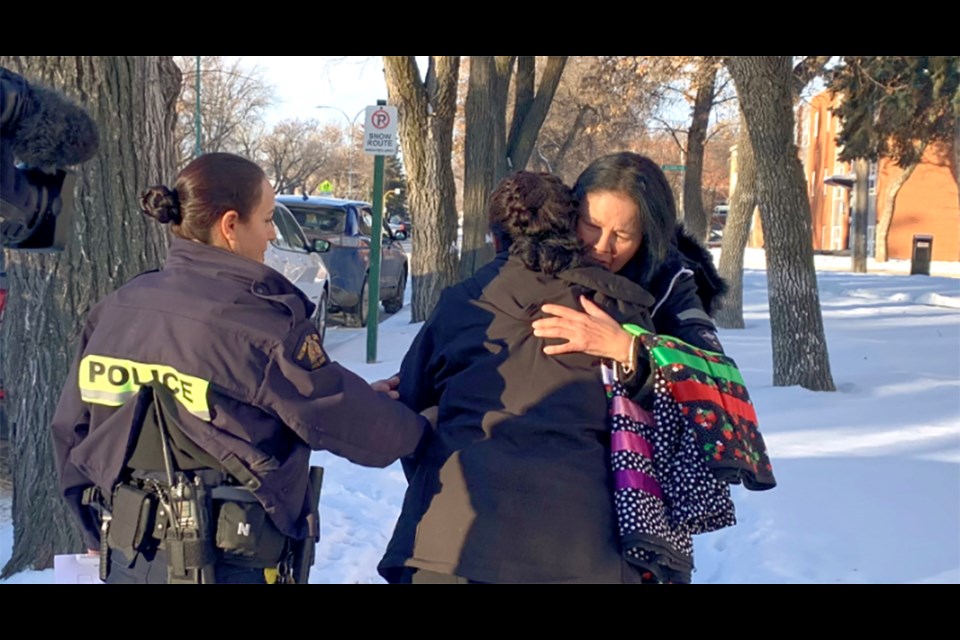 At the Yorkton Court of King's Bench in November 2022, Nerissa and Odelia Quewezance embrace for the first time in 18 years.