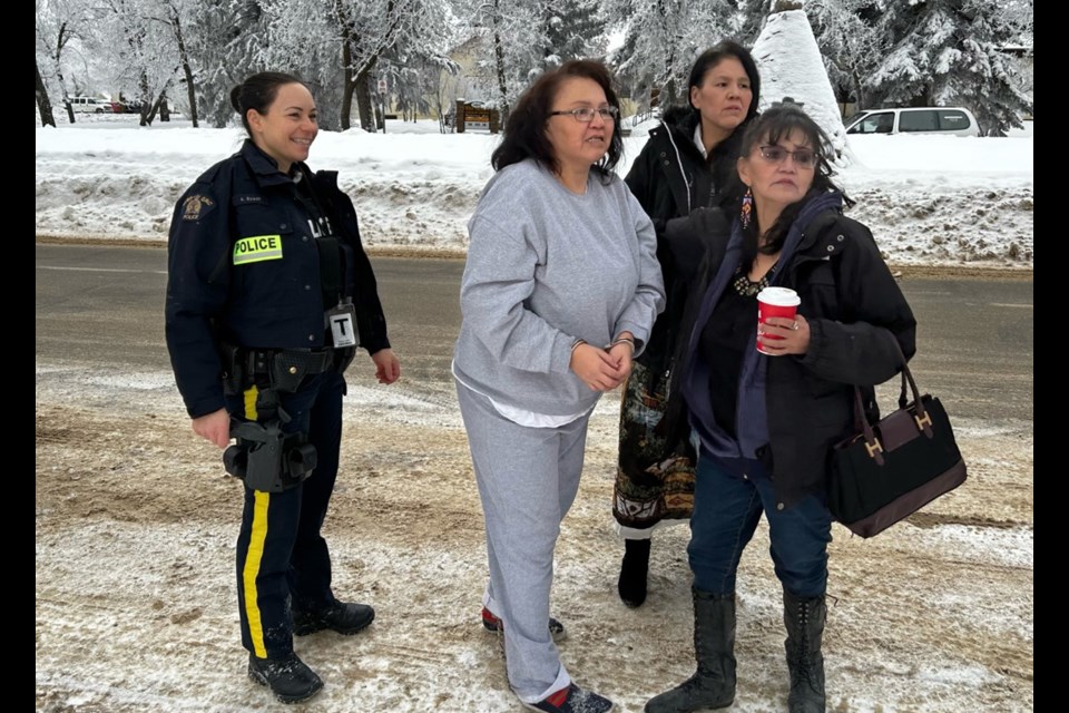 Nerissa Quewezance is escorted by police to meet her sisters Odelia and Bonnie as they enter court in Yorkton in January.