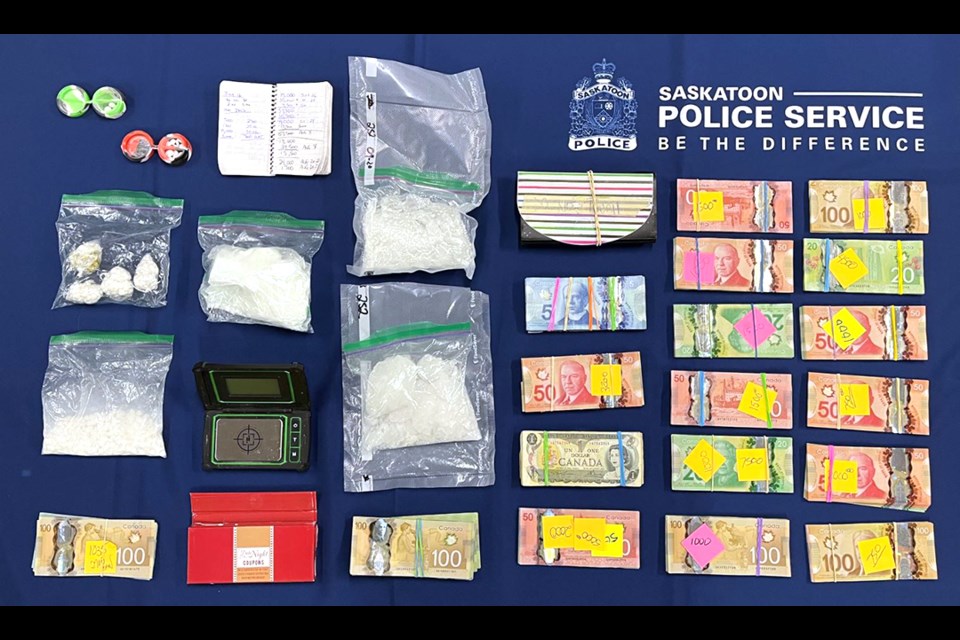 Saskatoon Police seized more than $20,000 in cash, a 2013 Lincoln, a 2009 Hyundai, and cocaine in a drug trafficking investigation.