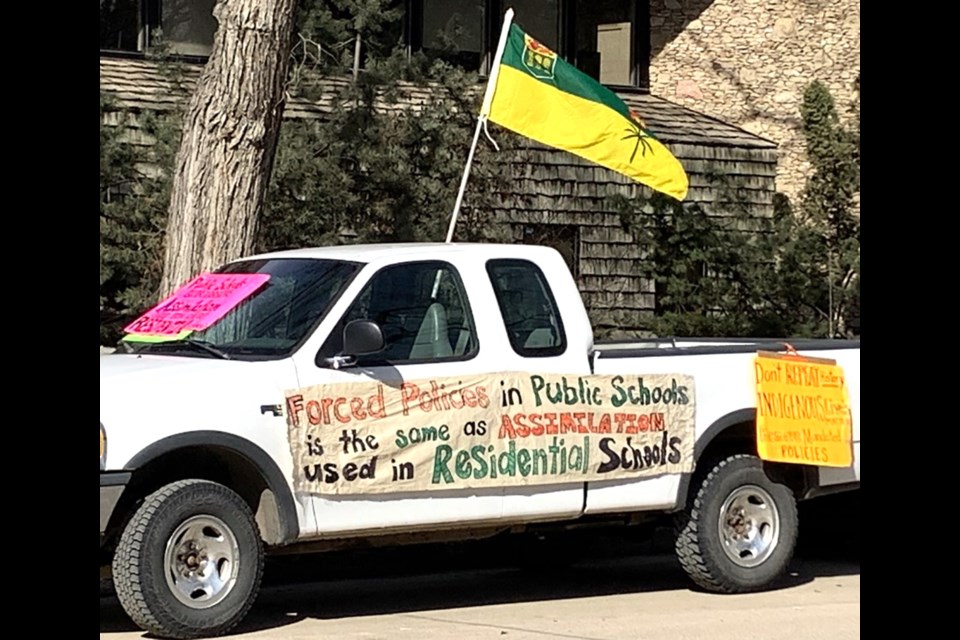 Stella Chipesia with her truck protesting on public land across from the elementary school her children attend. 