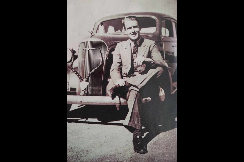 David Keay poses on the front of the new car he bought with his Uncle Sandy. An impala skull adorns the front.