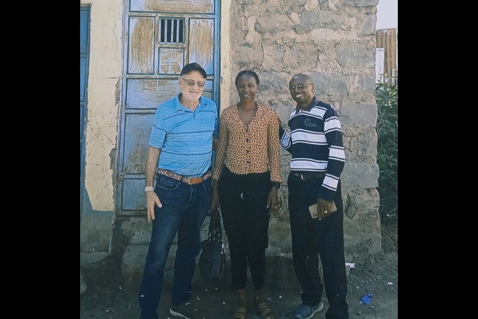 Pictured are Give Me Water Lord president Vic Hamer, Field Representative Jane Ntaoti and Pastor Charles Mainia at Ruth's Well. This water well was placed in Kasarani in 2011. Hamer continues to return to the previous GMWL well projects to be sure the wells are continuing to work.