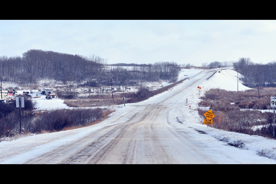 This photograph of Highway 5, left, looking to the east, shows the portion of the highway that goes over the CN Railway (in the distance) and the turn-off to the community of Runnymede.