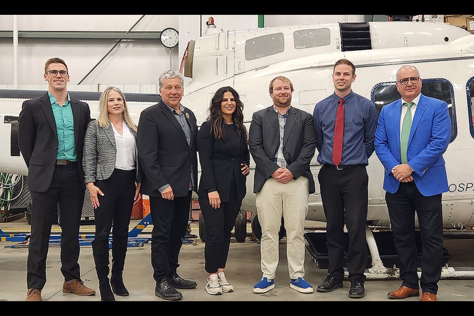 PrairiesCan Minister Dan Vandal, third left, joins the recipients of the funding along with Rivercity Innovations Chief Operating Officer Sue Timmerman, second left, and Saskatchewan Indian Institute of Technology President Riel Bellegrade.