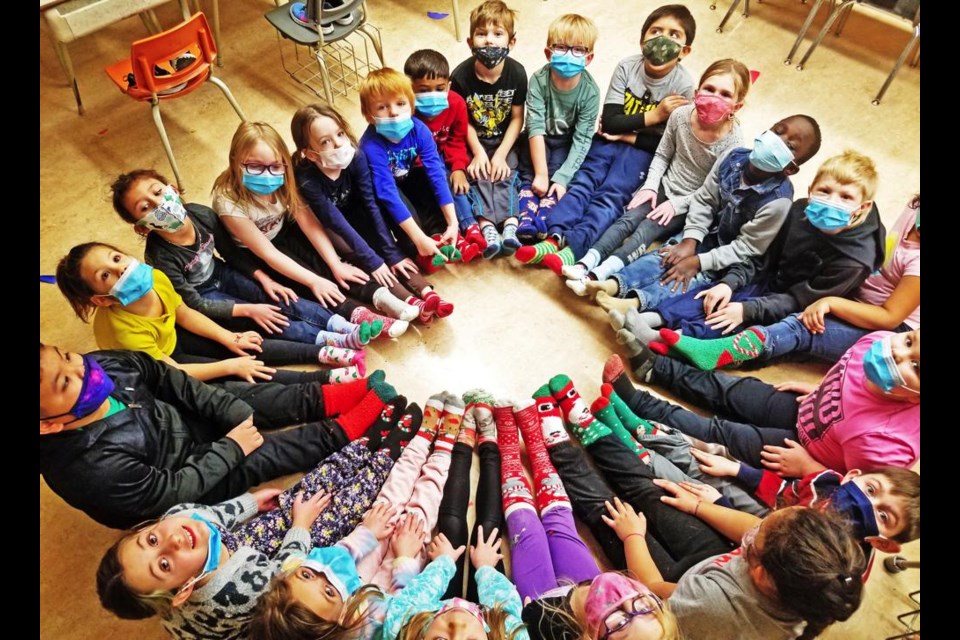 The students in Beth Risling's Grade 1 class showed off their Christmas socks in class at St. Michael School on Wednesday.