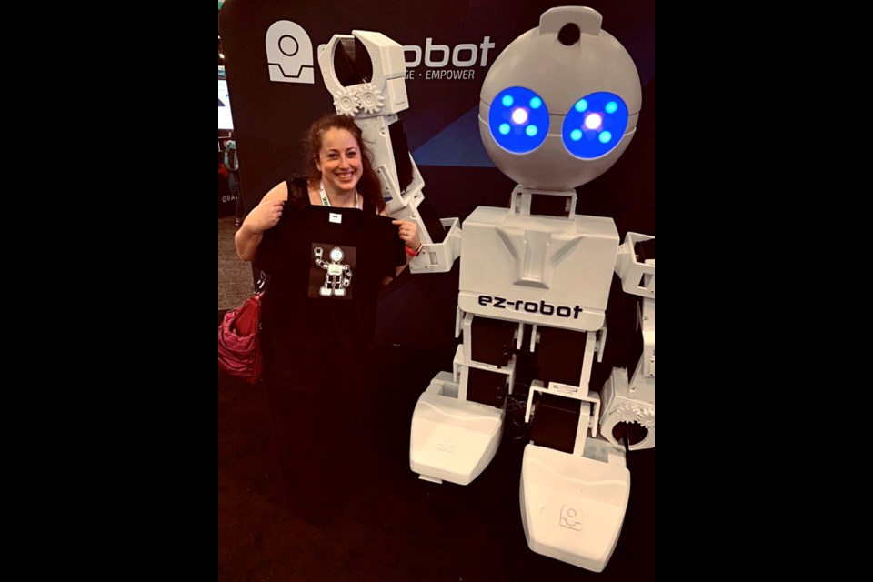 Agnes Garrioch with Ex-robot at the Future of Educational Technology Conference. 