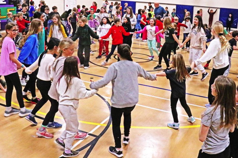 Many students joined in to a circle at Assiniboia Park's school dance recently.