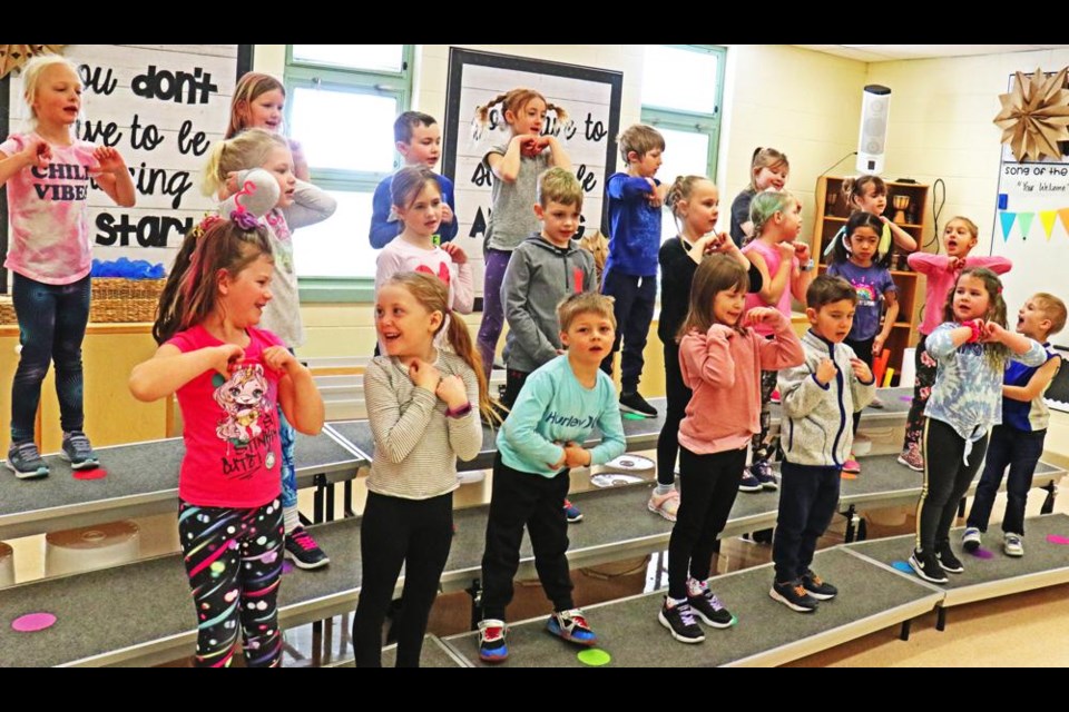 The APES Grade 1 choir sang about being "Under the Shady Tree" for their second song for the music festival