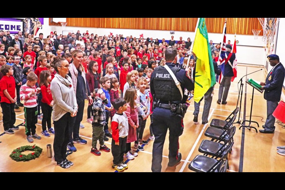 The Weyburn Legion Colour Guard entered the gym at Assiniboia Park Elementary to open the service of Remembrance on Friday morning.